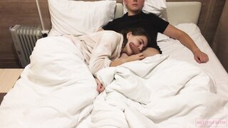 Hottie gives a relaxing home blowjob while watching a movie