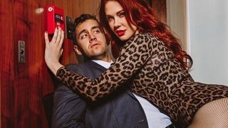 A passionate red-haired beauty is engaged in anal and licks a guy's anus on the couch